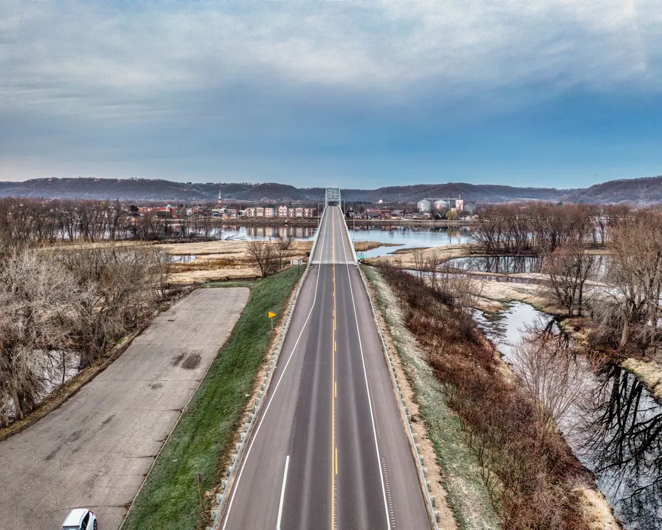 A scenic aerial view of a bridge over the Mississippi River in Wabasha, Minnesota, during winter.